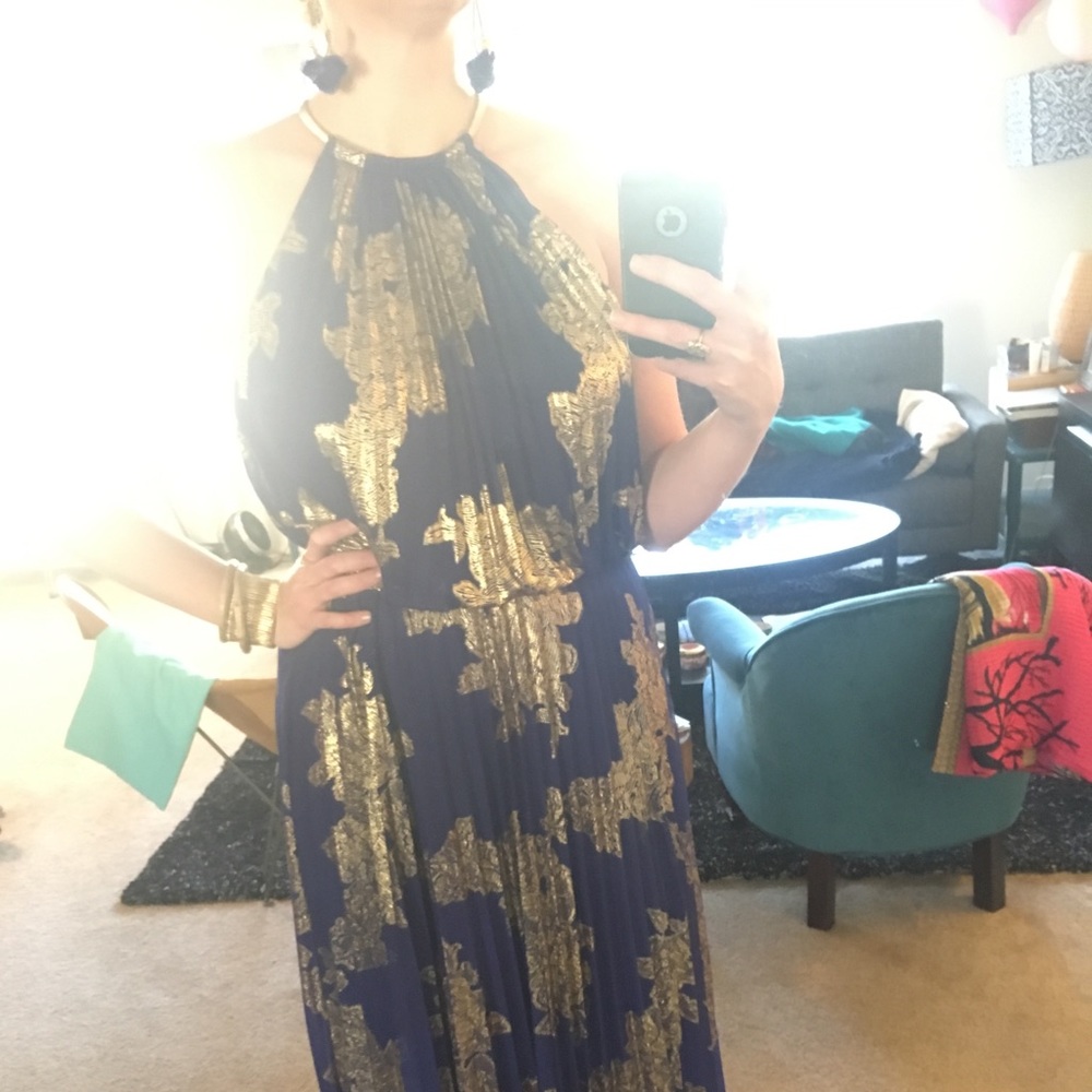 Full length gold and royal blue gown for wedding.